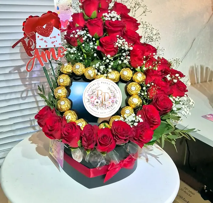Heart gift box with a cascade of red roses and Ferrero Rocher chocolates